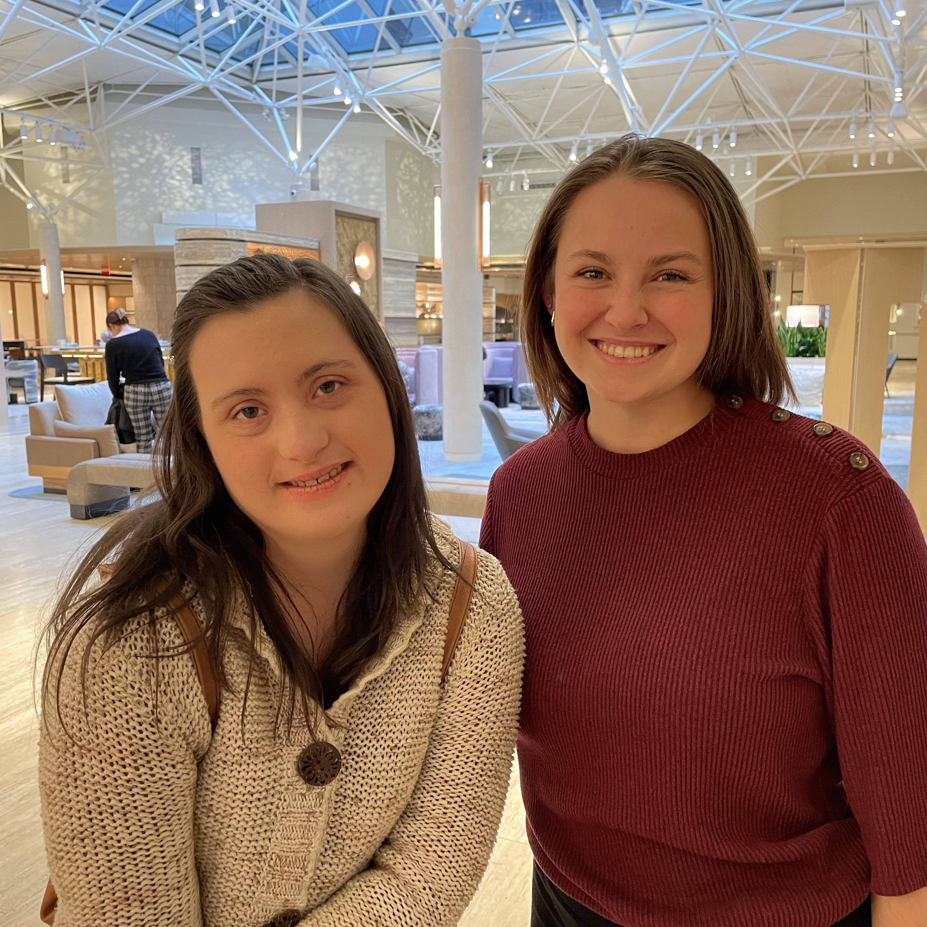 Two white women with shoulder length straight brown hair smiling at the camera, both college students from University of Colorado Colorado Springs. 