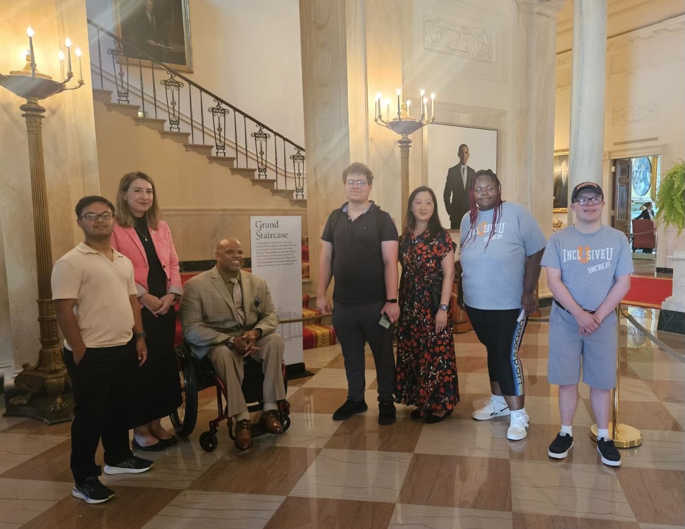 Image of all of the students with Assistant Secretary Gallo, Commissioner Allen, and Anna Perng in the White House.