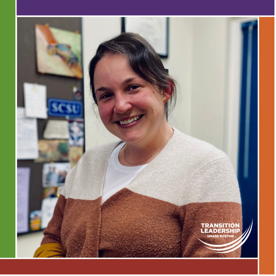 Annalise Abdelnour stands smiling in front of a bulletin board. Photo is surrounded by ICI logo color bars and the Transition Leadership program logo is in the bottom corner.