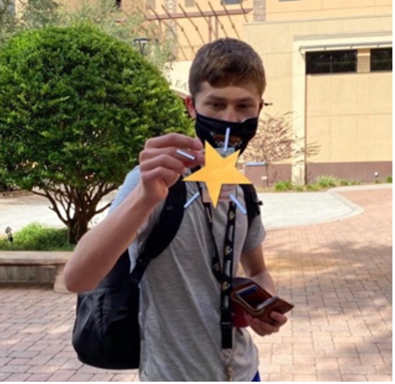 Young man walking on campus