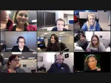 Image of computer screen with people pictured in smaller screens, using the Zoom technology