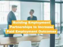 photo of two people in an office with title of article over top