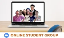 desk with a laptop and photo of a group of students with a zoom logo and words online student group 
