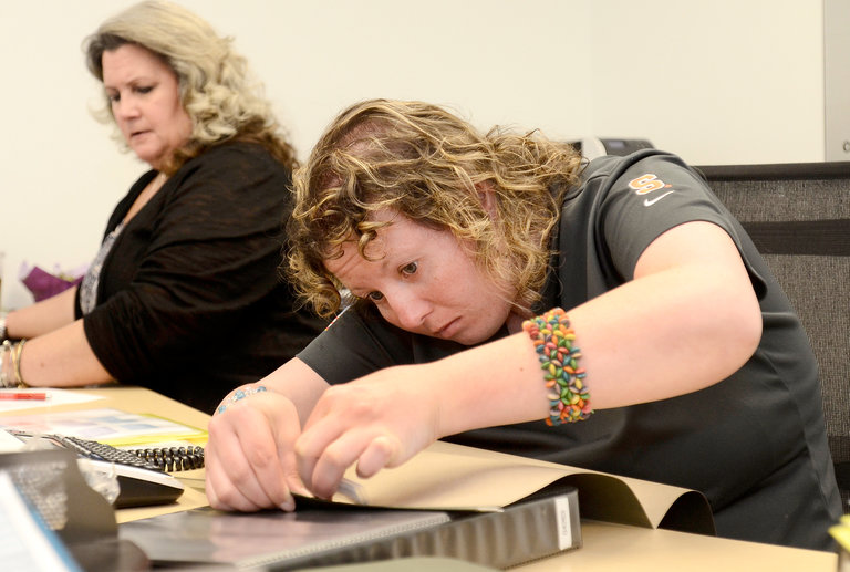 Syracuse University student working in class
