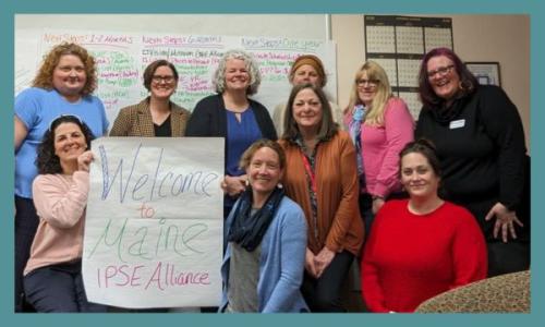 9 women with flip chart pages on the walls with misc notes
