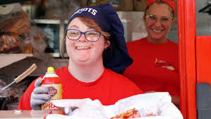 Woman smiling, working in a kitchen