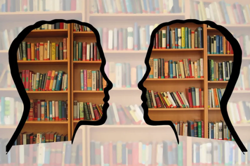 a library with the silhouettes of two faces  