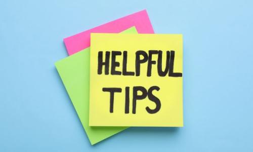 pile of post it notes and text reads helpful tips